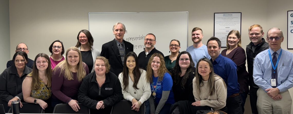 Rep. Robert Bierman (DFL-Apple Valley), fourth from left, second row, with mental health and substance use treatment clinicians and leaders at Nystrom & Associates Apple Valley Clinic.