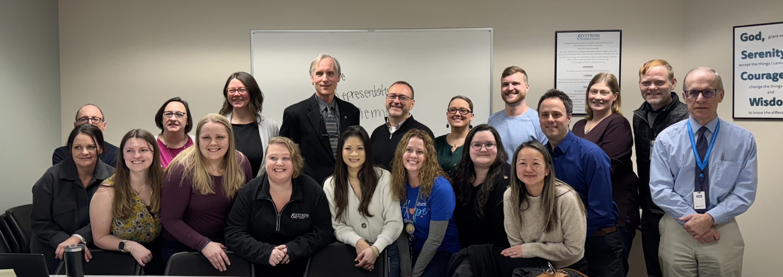 Rep. Robert Bierman (DFL-Apple Valley), fourth from left, second row, with mental health and substance use treatment clinicians and leaders at Nystrom & Associates Apple Valley Clinic.